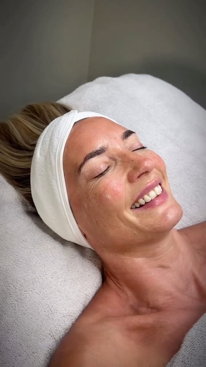 Client with fresh-looking skin resting after a facial appointment